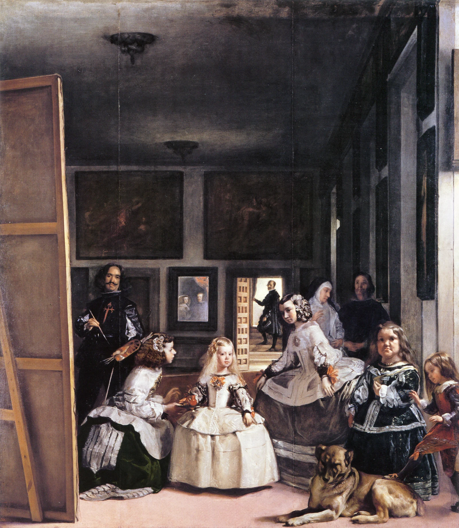 As Meninas: infanta Margarida ao centro, damas ao redor, Velázquez à esquerda e um espelho com os monarcas na parede do fundo